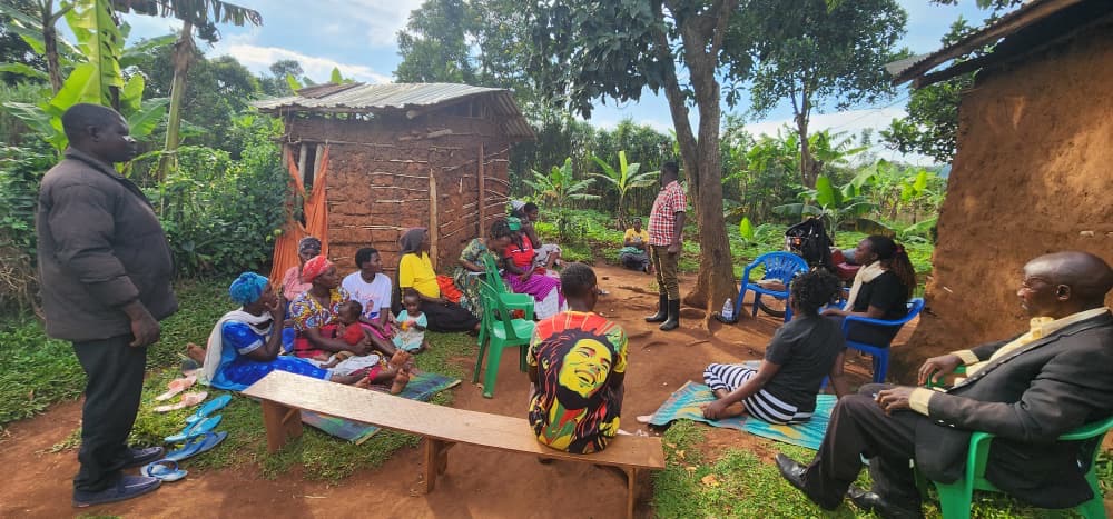 Community gathering near a homestead in Uganda